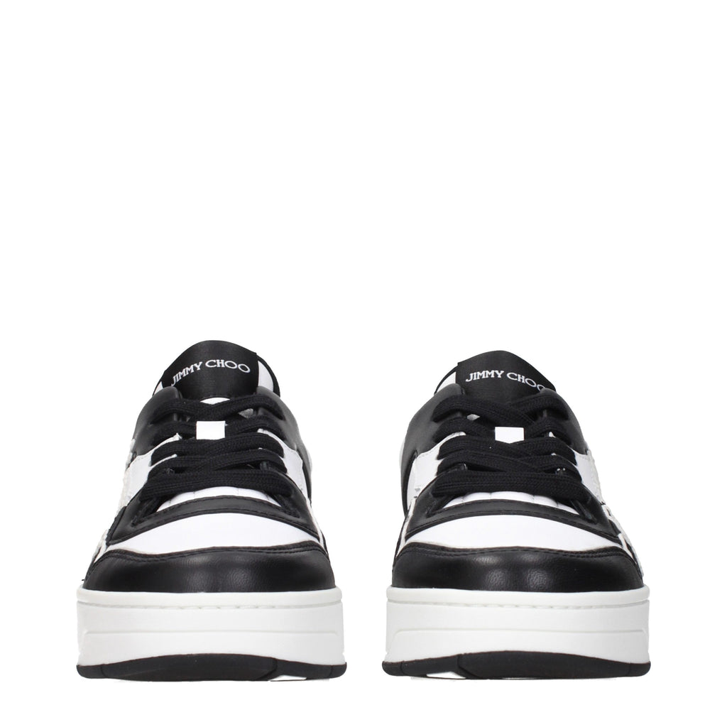 Jimmy Choo black leather low top sneakers with sleek design and white soles, showcasing stylish casual footwear.