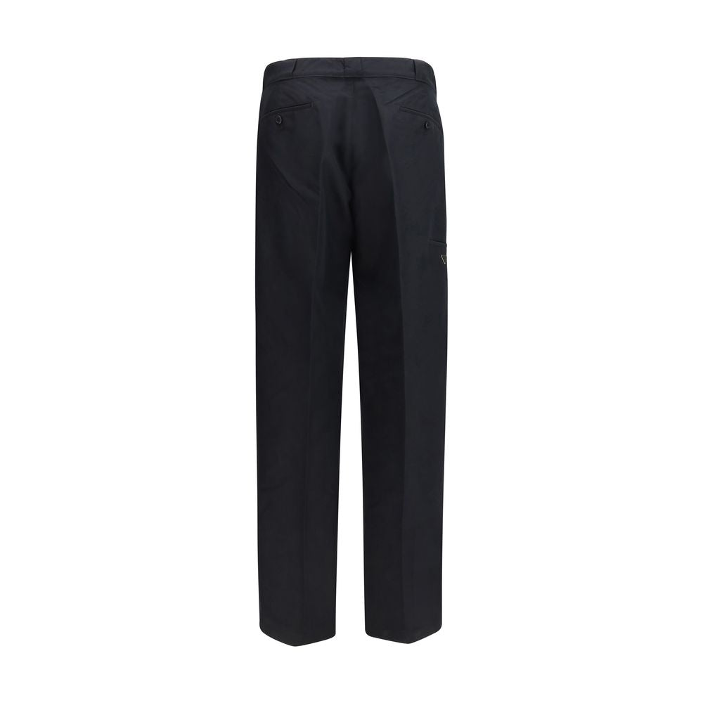 Prada black cotton casual pants displayed flat, featuring a relaxed fit and subtle branding details.
