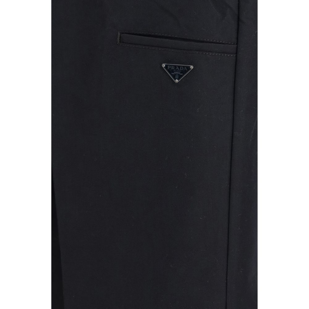 Prada black cotton casual pants with a relaxed fit, featuring a smooth fabric and classic design, suitable for everyday wear.