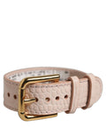 Dolce & Gabbana pink embossed leather belt strap bracelet with gold buckle, stylish accessory featuring embossed design and gold hardware.