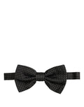 Elegant black silk polka dot bow tie by Dolce & Gabbana with adjustable neck strap for men.