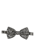 Dolce & Gabbana black and white paisley silk bow tie with adjustable neck strap, stylish and elegant accessory.