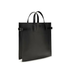 Valentino Garavani black calf leather Bos Taurus shoulder bag with silver hardware and sleek design.