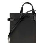 Valentino Garavani black calf leather Bos Taurus shoulder bag with silver hardware and adjustable strap.