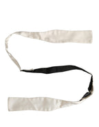 Dolce & Gabbana men's white silk adjustable bow tie with papillon style, showcasing elegant design and fine craftsmanship.