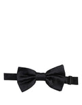 Dark blue Dolce & Gabbana silk adjustable bow tie with papillon style, perfect for formal occasions and stylish menswear.