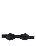 Dolce & Gabbana men's dark blue silk bow tie with adjustable neck strap, featuring a classic papillon style.
