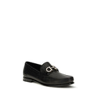 Ferragamo black calf leather Bos Taurus slip-on loafers with sleek design and classic style.