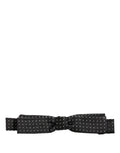 Dolce & Gabbana black and white polka dot adjustable neck papillon bow tie on display, showcasing elegant luxury accessories.