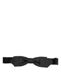 Black polyester bow tie with adjustable neck strap from Dolce & Gabbana, featuring a classic papillon style for men.