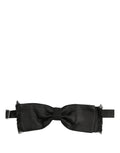 Dolce & Gabbana men's dark gray silk adjustable bow tie with papillon style and subtle sheen, perfect for formal occasions.