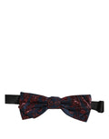 Dolce & Gabbana men's blue and red paisley adjustable neck papillon bow tie lying flat.