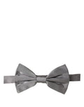Gray silk adjustable bow tie by Dolce & Gabbana with classic papillon style for men's formal wear.