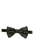 Dolce & Gabbana men's black silk star-patterned adjustable papillon bow tie on a white background.