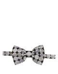 Dolce & Gabbana men's black and silver circle design adjustable neck papillon bow tie on a white background.