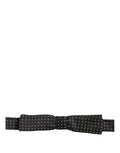 Dolce & Gabbana black and white polka dot adjustable neck papillon bow tie on a model.
