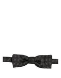 Dolce & Gabbana black and white polka dot bow tie with adjustable neck strap, featuring a papillon style for formal wear.