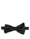 Dolce & Gabbana men's black silk adjustable papillon bow tie displayed on a hanger.