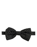 Dark gray patterned Dolce & Gabbana men's adjustable neck papillon bow tie, showcasing elegant fabric and classic design.