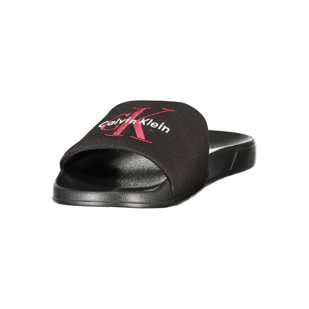 Calvin Klein black polyester men's slipper with cushioned sole and slip-on design, ideal for indoor comfort.