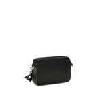 Prada black nylon shoulder bag with adjustable strap and sleek design, showcasing its minimalist style and high-quality material.