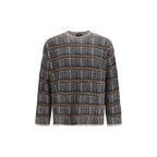 Giorgio Armani blue silk sweatshirt with a smooth, luxurious fabric and classic fit, displayed on a hanger against a neutral background.