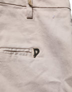 Dondup beige low waist tapered cropped women's trousers, showing the fit and fabric texture of the stylish pants.