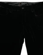 Ermanno Scervino black viscose blend velvet slim fit pants displayed on a hanger, showcasing their sleek design and luxurious fabric.
