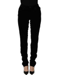 Black Ermanno Scervino velvet slim fit pants made from viscose blend, shown on a model with a tailored, sleek design.