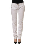 Daniele Alessandrini white cotton stretch skinny denim jeans displayed on a hanger, showcasing slim fit and classic five-pocket design.