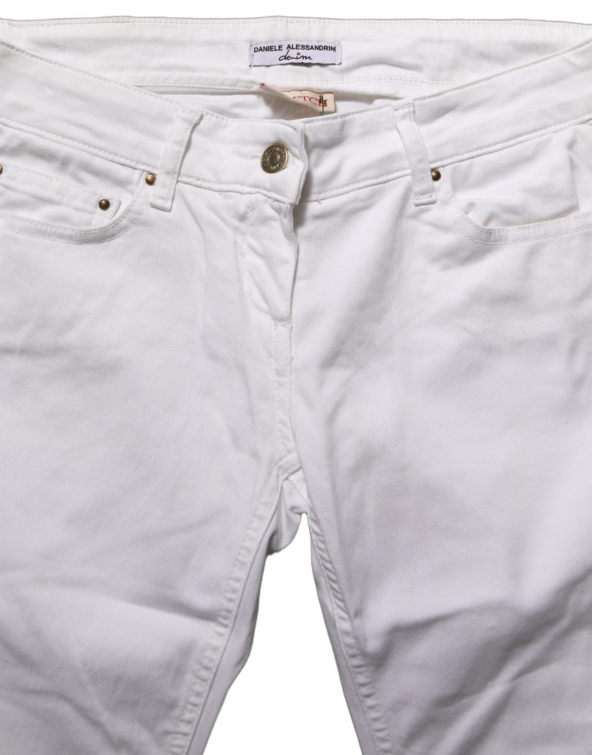 White cotton stretch skinny denim jeans by Daniele Alessandrini, showing close-up of fitted waist and classic five-pocket design.