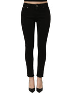 Black cotton stretch skinny denim jeans by Dolce & Gabbana, close-up of fitted design and classic five-pocket style.