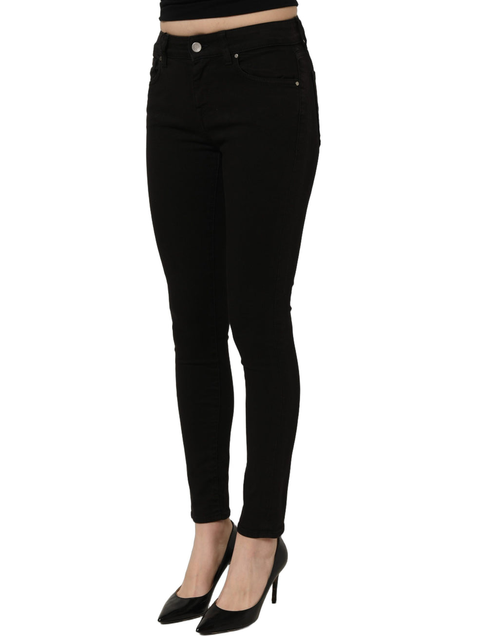 Black cotton stretch skinny denim jeans by Dolce & Gabbana displayed on a hanger with a modern background.