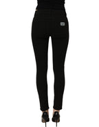 Dolce & Gabbana black cotton stretch skinny denim jeans displayed on a model, showcasing a fitted, stylish design.