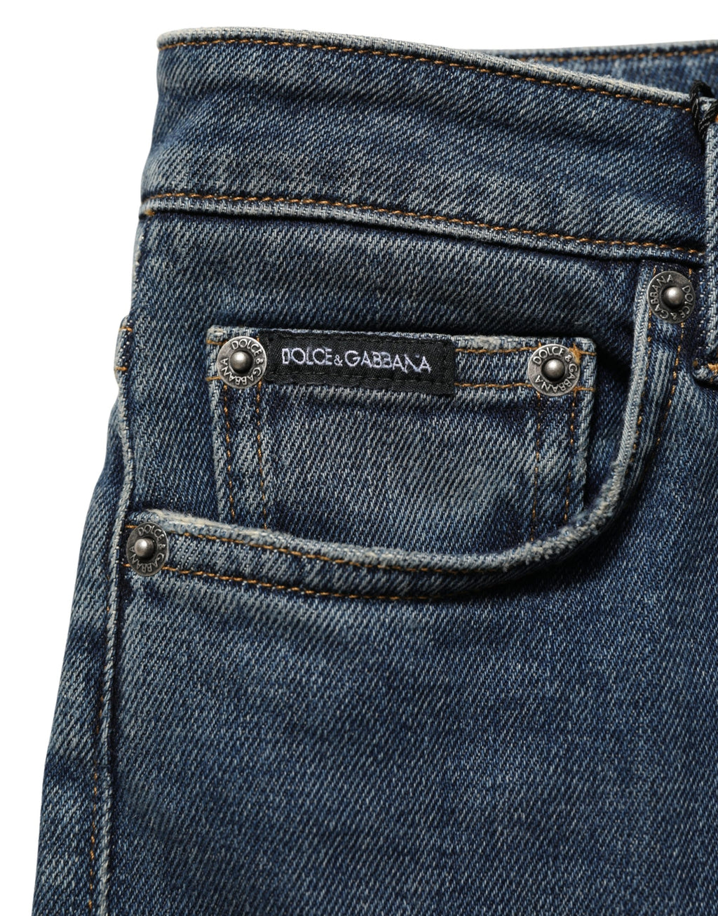 Blue cotton stretch skinny denim jeans by Dolce & Gabbana, shown folded with visible stitching and classic five-pocket design.
