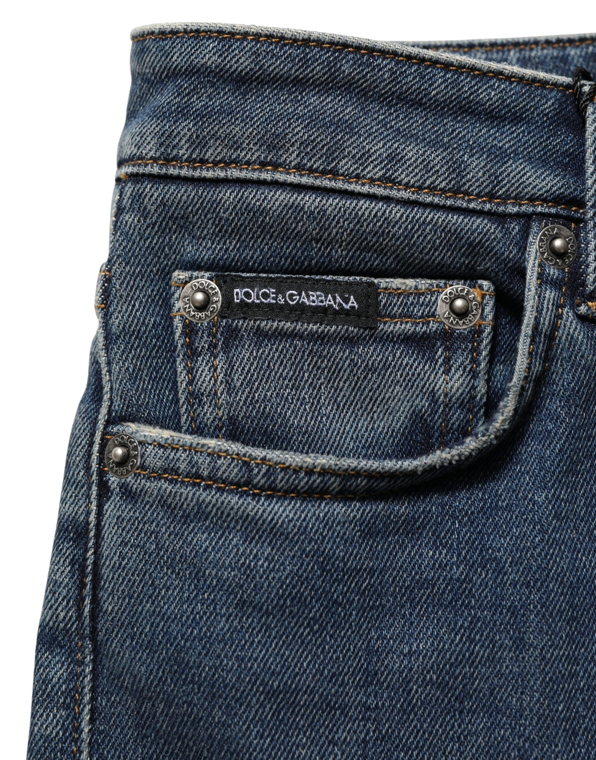 Blue cotton stretch skinny denim jeans by Dolce & Gabbana, shown folded with visible stitching and classic five-pocket design.