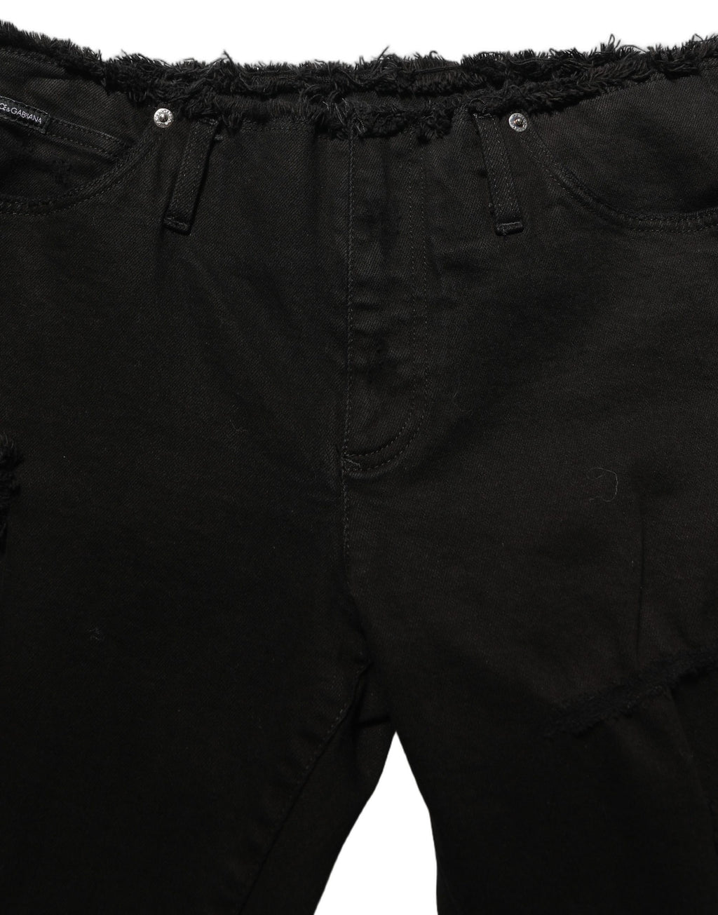 Black cotton skinny denim jeans by Dolce & Gabbana showing a close-up of the fitted trouser style and classic denim texture.