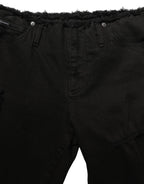 Black cotton skinny denim jeans by Dolce & Gabbana showing a close-up of the fitted trouser style and classic denim texture.