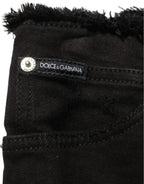 Black cotton skinny denim trousers by Dolce & Gabbana, showing the fitted design and classic five-pocket style.