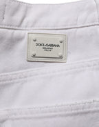 Dolce & Gabbana white cotton stretch wide-leg denim jeans laid flat, showing the high-waist and relaxed fit design.