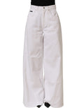 Dolce & Gabbana white cotton stretch wide-leg denim jeans displayed on a hanger with front and back view.
