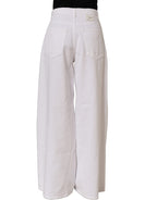 Dolce & Gabbana white cotton stretch wide leg denim jeans displayed on a hanger with a clean background.