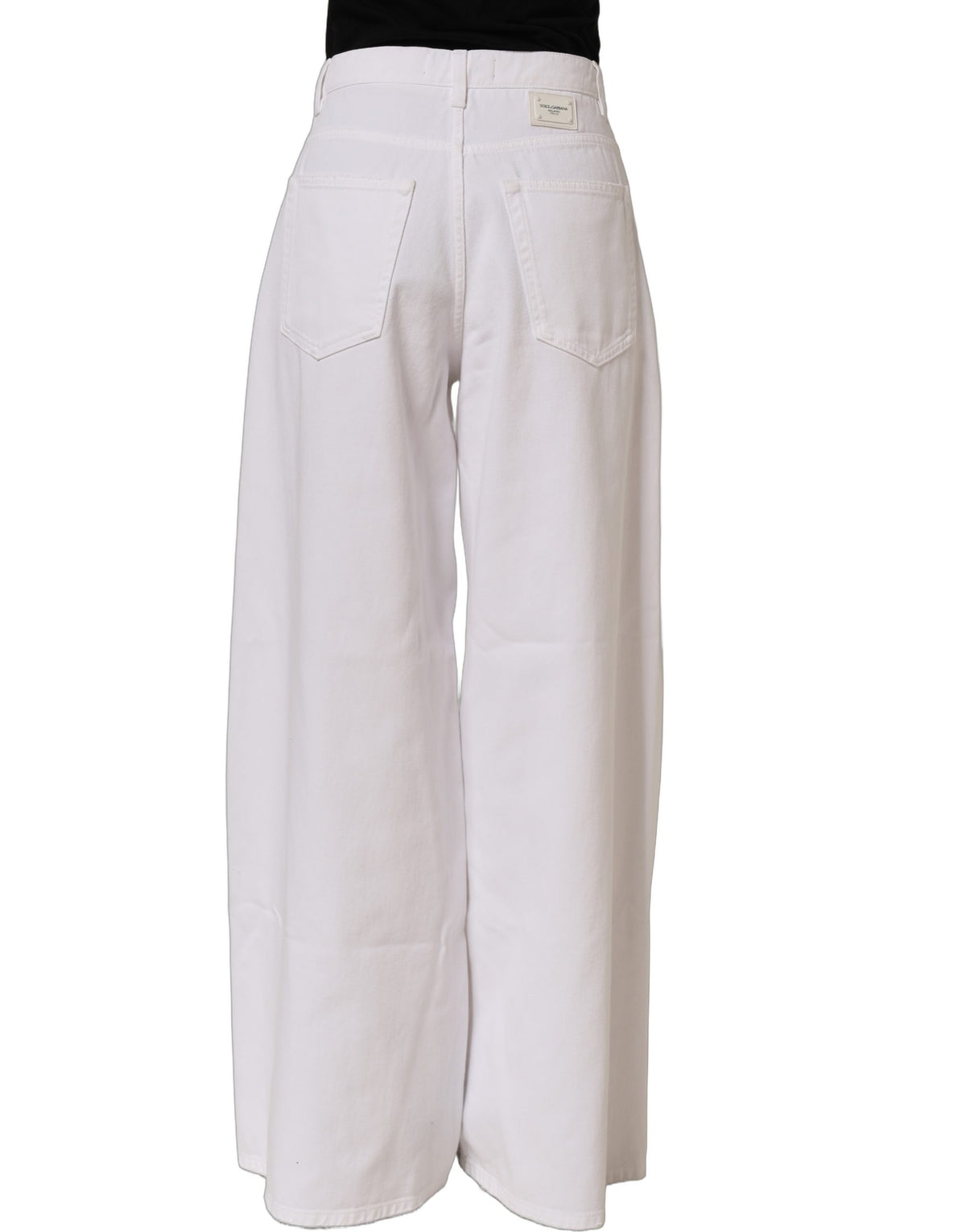 Dolce & Gabbana white cotton stretch wide leg denim jeans displayed on a hanger with a clean background.