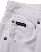 Dolce & Gabbana white cotton stretch wide-leg denim jeans displayed on a hanger, showcasing their relaxed fit and clean design.