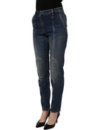 Dark blue cotton stretch skinny denim jeans by Dolce & Gabbana displayed on a hanger with visible stitching and classic five-pocket style.