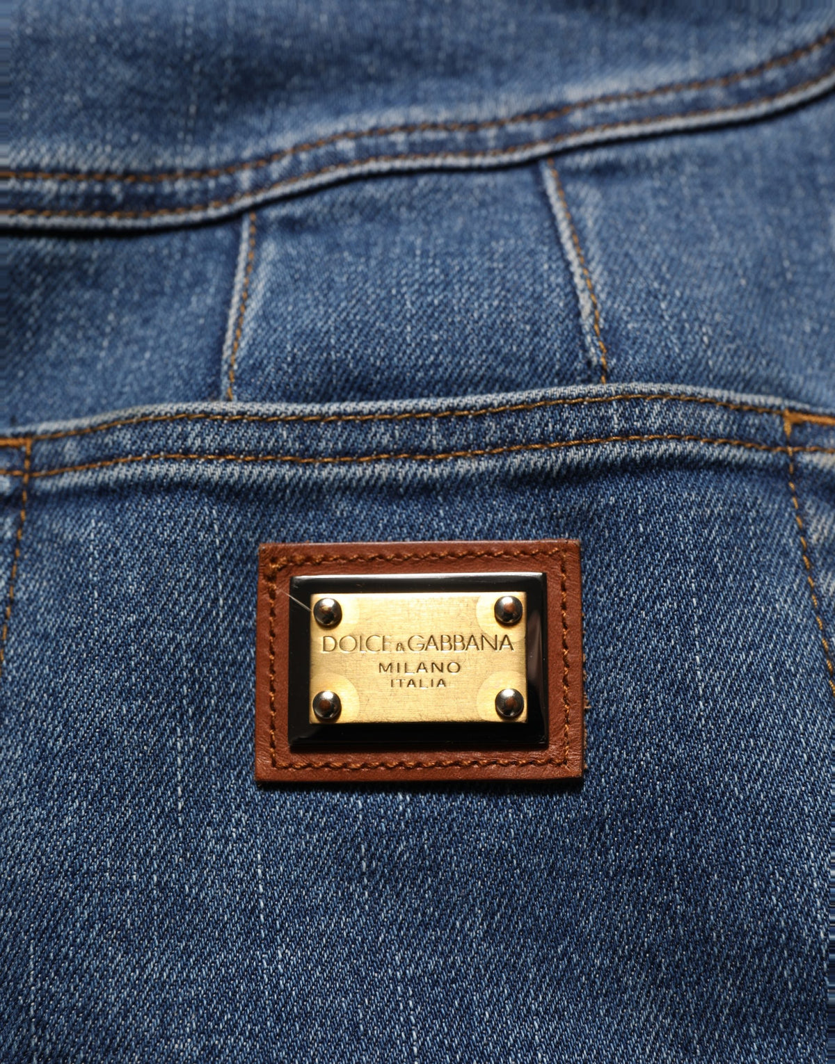 Dark blue cotton stretch tapered denim jeans by Dolce & Gabbana, showing classic fit and detailed stitching.