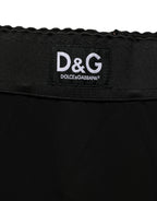 Black viscose high waist Capri trouser pants by Dolce & Gabbana, with a tailored fit and classic design.
