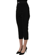 Black Dolce & Gabbana viscose high-waist capri trouser pants displayed on a hanger, showcasing the sleek, tailored design.