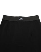 Black viscose high-waist Capri trouser pants by Dolce & Gabbana, featuring a tailored fit and classic style.