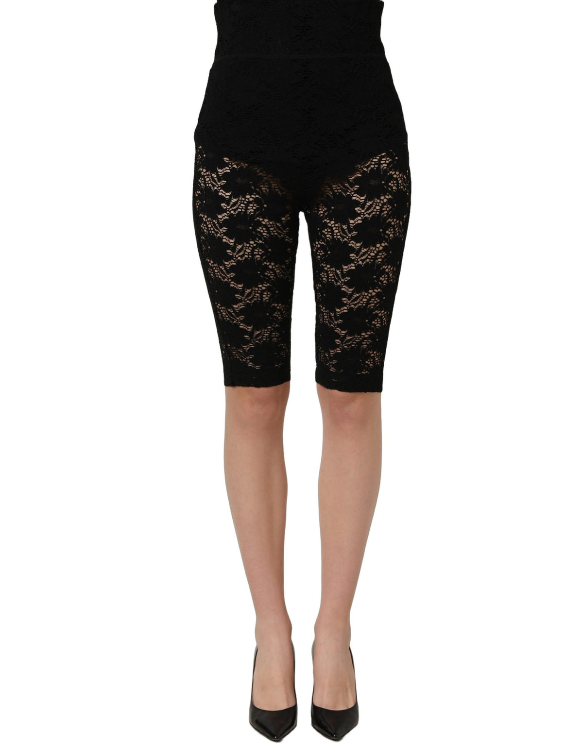 Black high waist sheer floral lace shorts by Dolce & Gabbana, detailed with intricate lace patterns and a fitted silhouette.